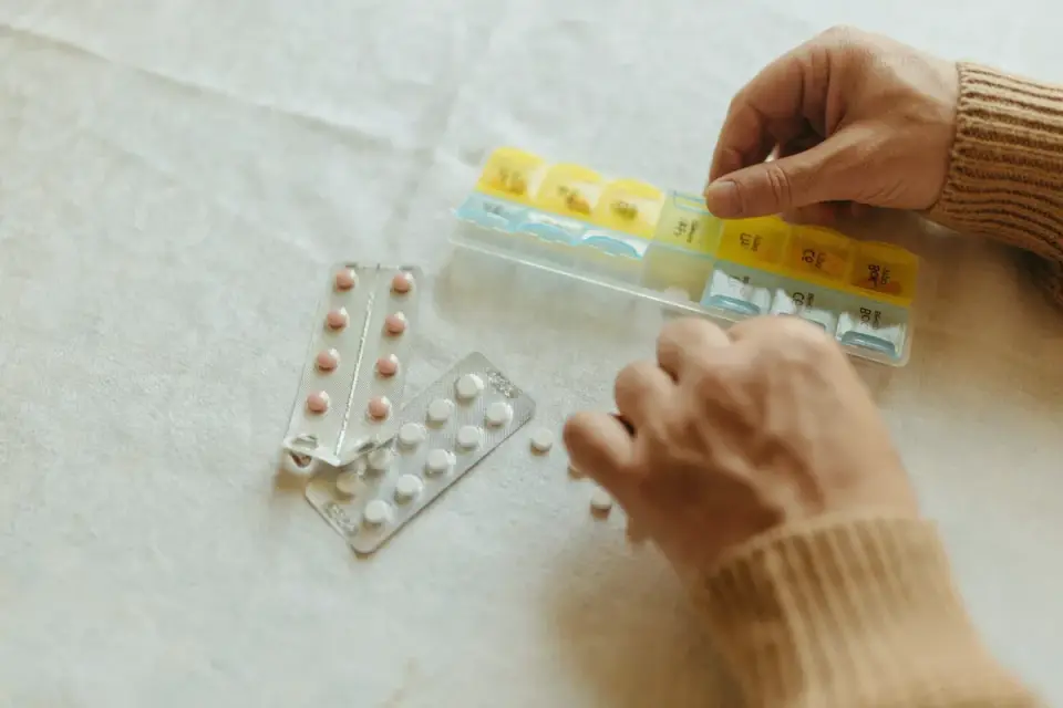 A veterinarian&#x27;s hands measuring out soft chew supplements for a dog