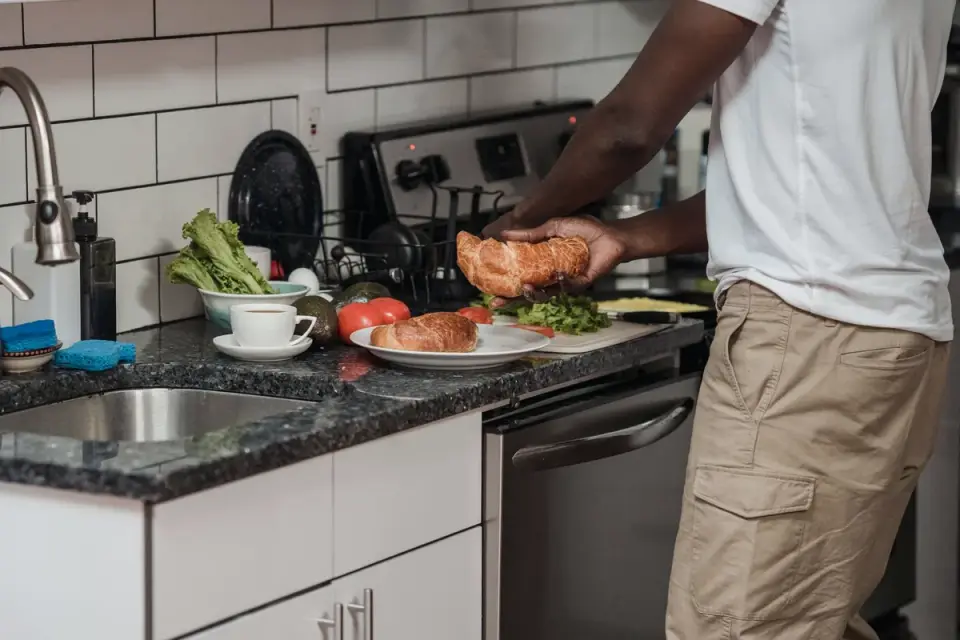 Dog owner preparing a meal